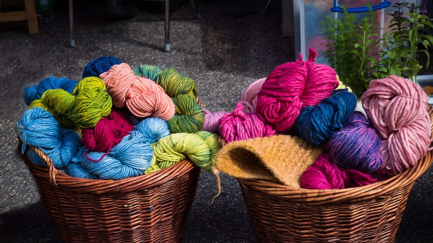 baskets of multicoloured wool for knitting