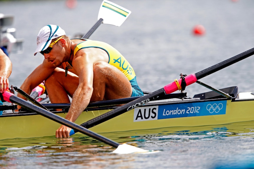 Chris Morgan slumps while in the rowing boat.