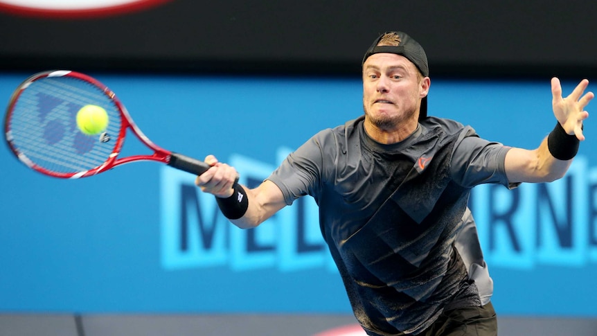 Australia's Lleyton Hewitt plays China's Ze Zhang on Rod Laver Arena at the Australian Open.