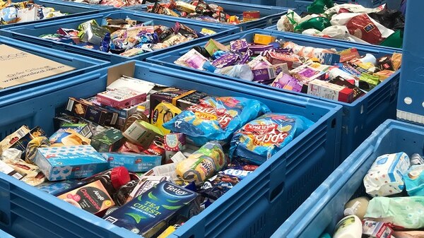 Pallets stuffed with food in a warehouse.