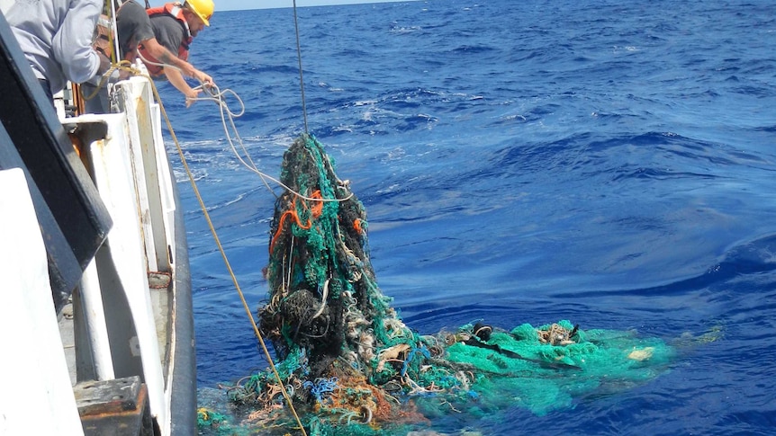 A ghost net is hauled aboard the research vessel