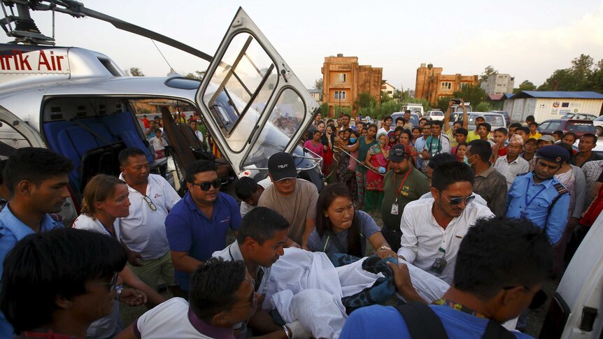 Body of victim in Nepal helicopter crash carried towards ambulance