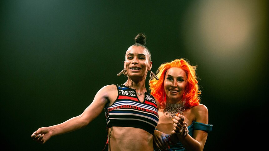 Two women smiling on stage at Sissy Ball 2019 (Leiomy Maldonado and Bhenji Ra).