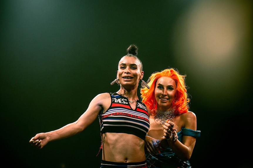 Two women smiling on stage at Sissy Ball 2019 (Leiomy Maldonado and Bhenji Ra).