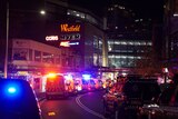 westfield bondi sign with ambulances in front of building