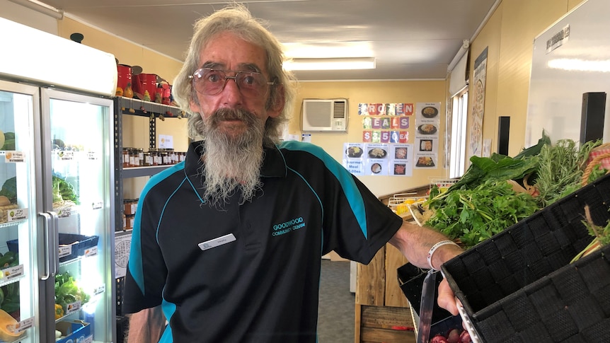 Wally Douglass standing next to fresh vegetables at the Waterbridge Food cooperative in Gagebrook, Tasmania