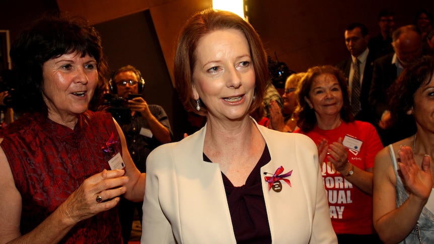 Prime Minister Julia Gillard as she is greeted at a forum of social and community workers in Sydney.