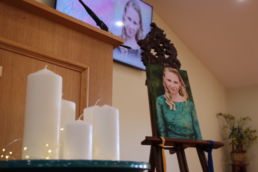 Candles and portraits at the funeral for Shyanne-Lee Tatnell.