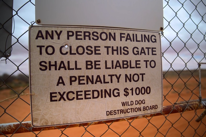 A sign on a fence that reads: Any person failing to close this gate shall be liable to pay a penalty not exceeding $1000