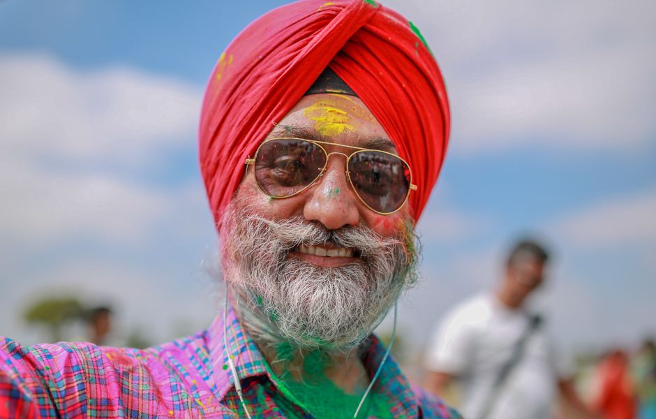 Guri Singh covered in coloured powder