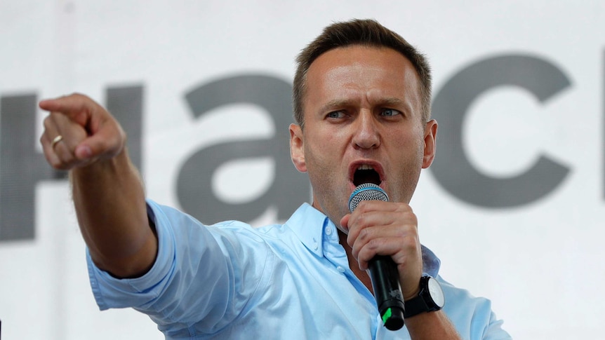 Russian opposition activist Alexei Navalny gestures while speaking to a crowd