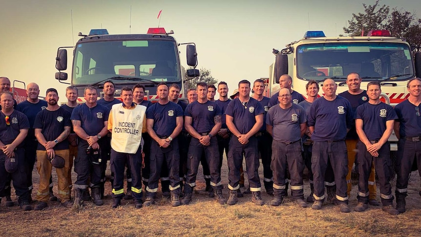 Incident Controller Patrick Westwood on the fireground with members of the WA strikeforce.