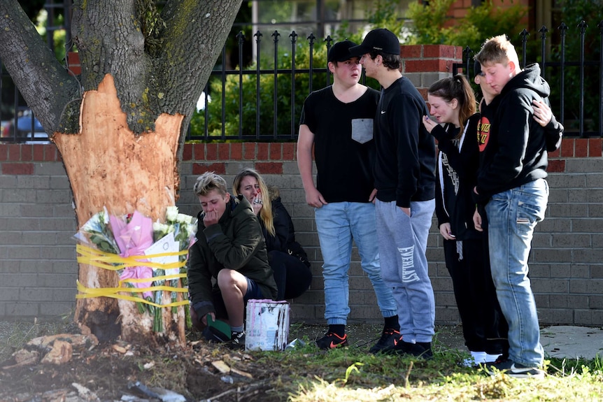 Mourners lay flowers at the scene of a crash at Sunshine west