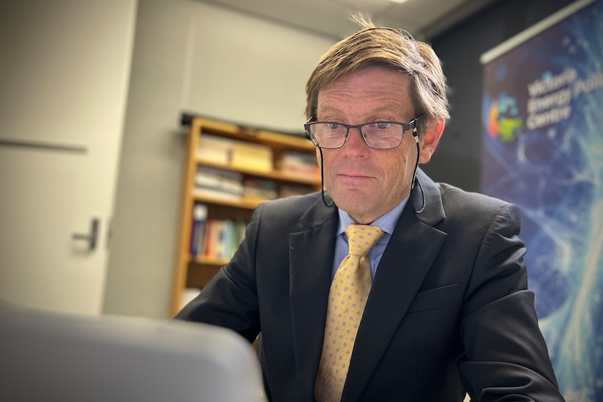 A man at a desk.