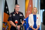 NT Police Commissioner Jamie Chalker and Police Minister Nicole Manison standing next to each other at a press conference