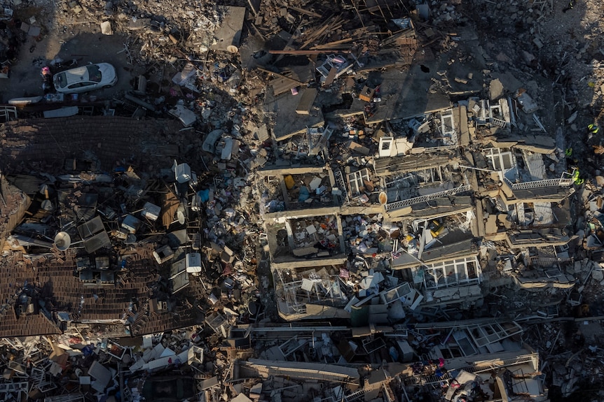 Aerial view of collapsed buildings in Turkiye neighbourhood.