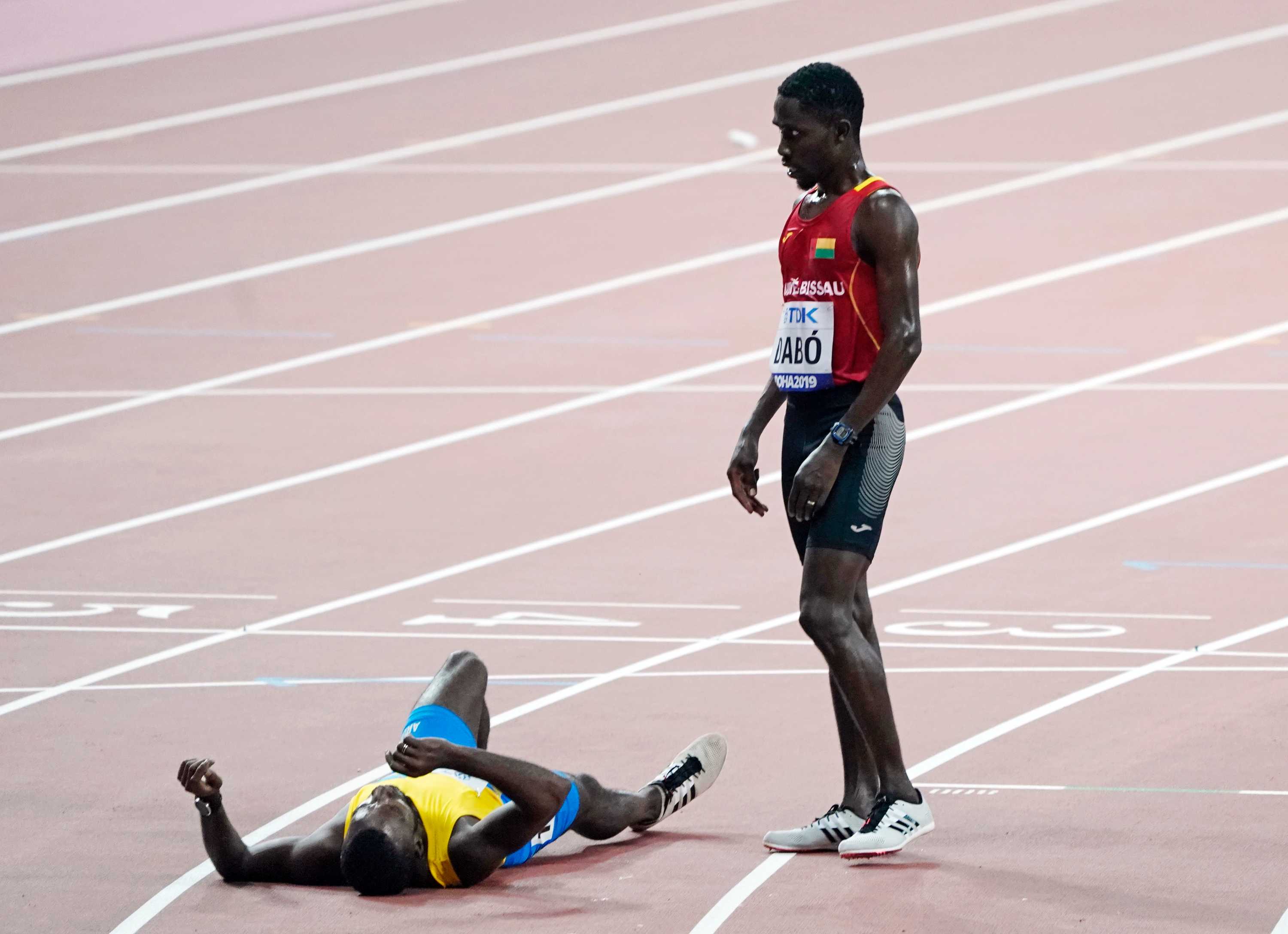 World championships athlete Suncar Dabo helps rival Jonathan Busby