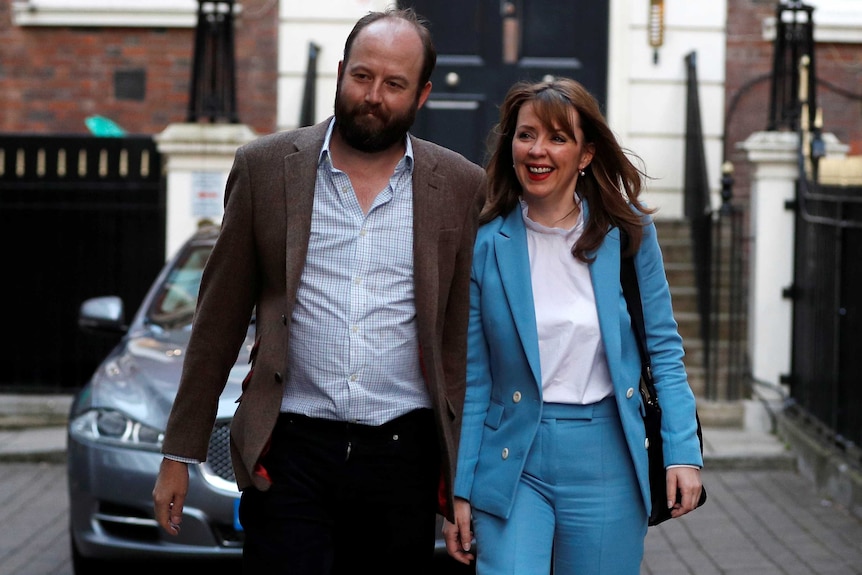 Nick Timothy and Fiona Hill walk towards camera down a London street.