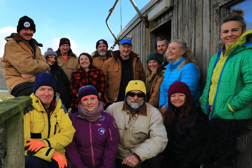 Macquarie Island team on hut steps.