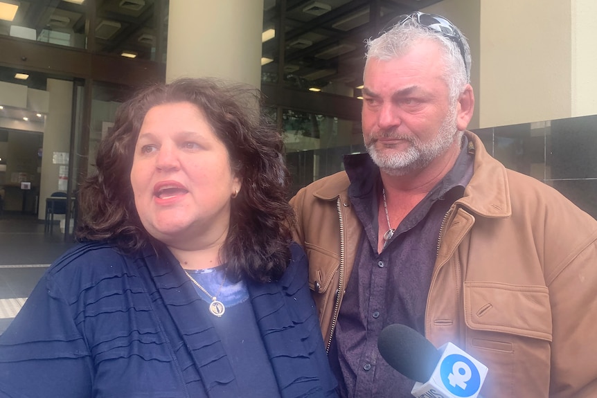 A couple speaking to the media outside court in Perth.