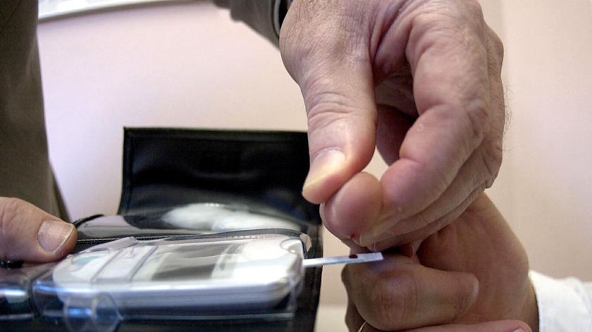 Generic pic of diabetic man having blood sugar levels tested