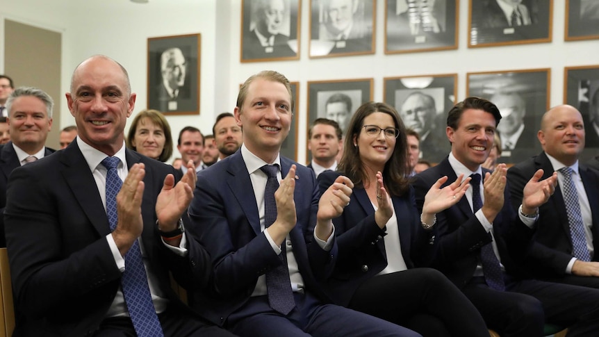 David Van, James Paterson, Claire Chandler, Jonathon Duniam and Matt O'Sullivan clap inside the Liberal party room