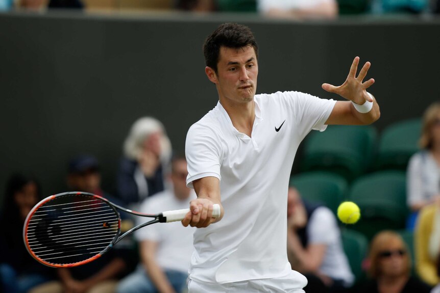 Straight sets ... Bernard Tomic plays a forehand against Roberto Bautista-Agut