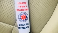 A seatbelt cover with the message: "I have Type 1 Diabetes. Insulin Dependent".