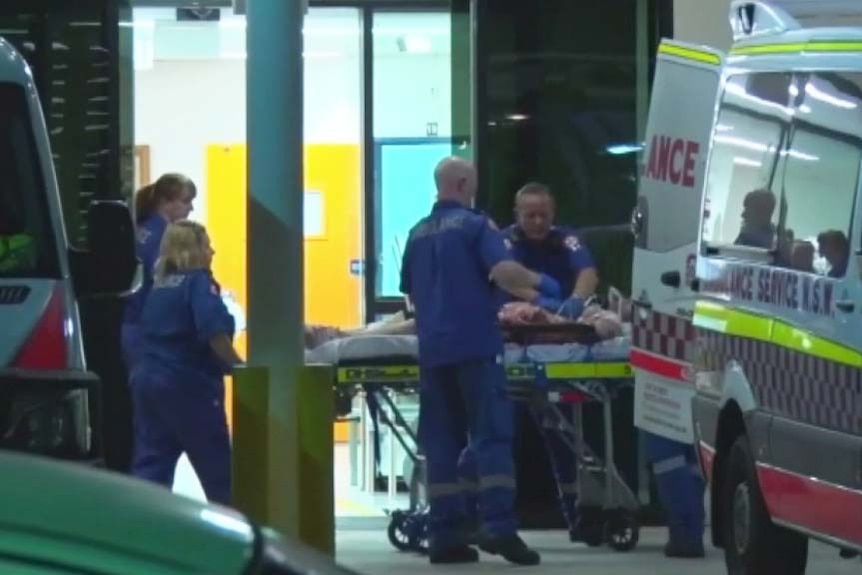 Paramedics work on Central Coast stabbing victim
