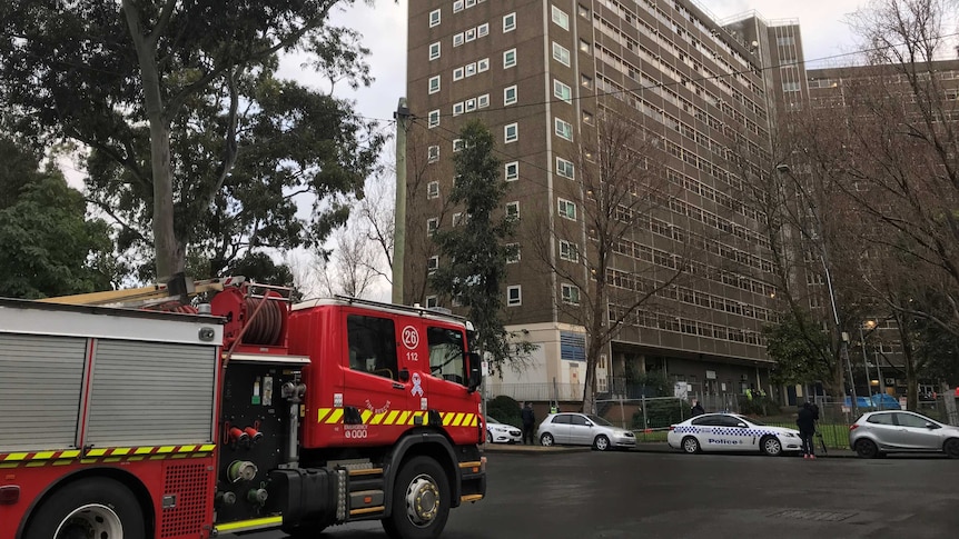 A fire truck sits outside a public housing tower in North Melbourne.