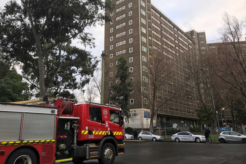 A fire truck sits outside a public housing tower in North Melbourne.