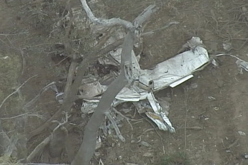 Aerial footage shows wreckage in bushland.