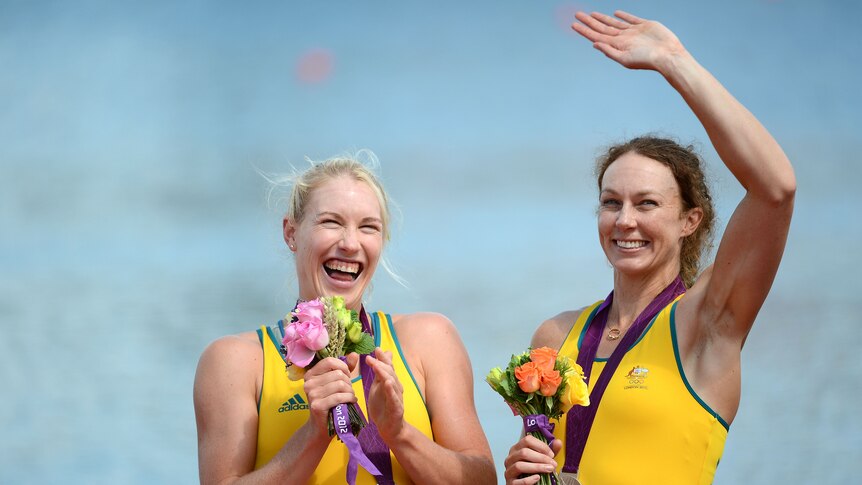 Australian rowers Kim Crow and Brooke Pratley of Australia celebrate with their silver medals.