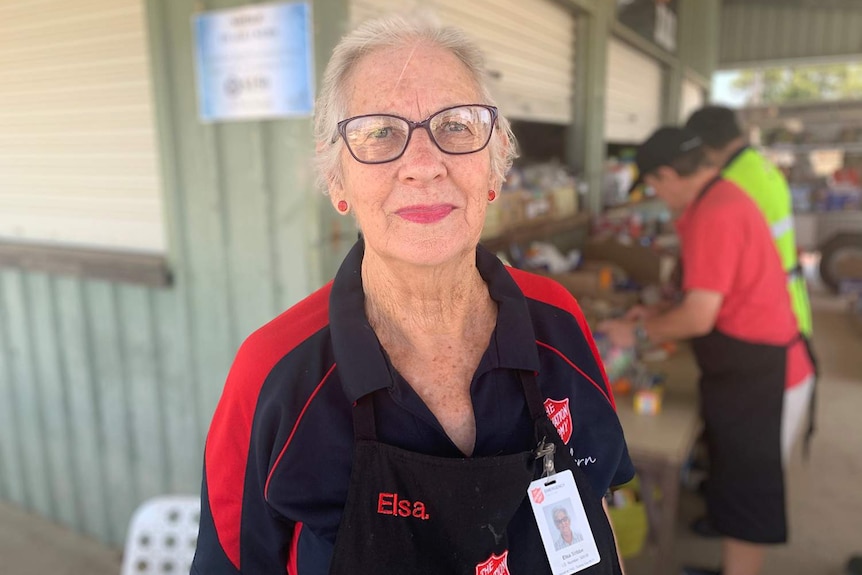 Elsa Stibbe stands under shed at Boonah coordinating volunteers preparing food packs for firefighters.