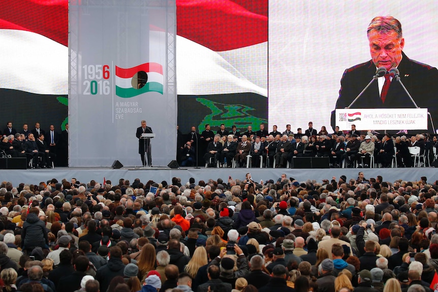 Hungarian Prime Minister Viktor Orban appears on stage speaking during the remembrance ceremony of the hungarian revolution