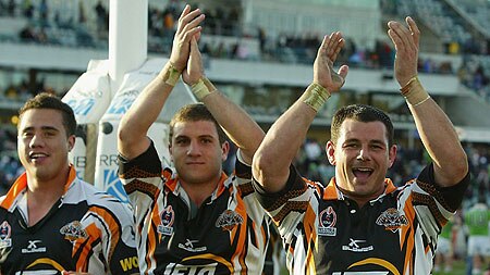 Wests Tigers players celebrate after their win against Canberra