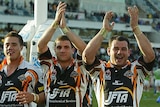 Wests Tigers players celebrate after their win against Canberra