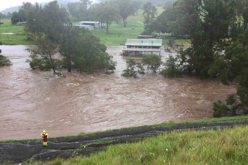 Floodwaters surround a house in Sarabah, Queensland.