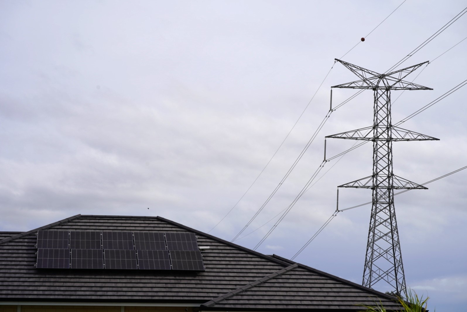 Rooftop solar with powerlines in background