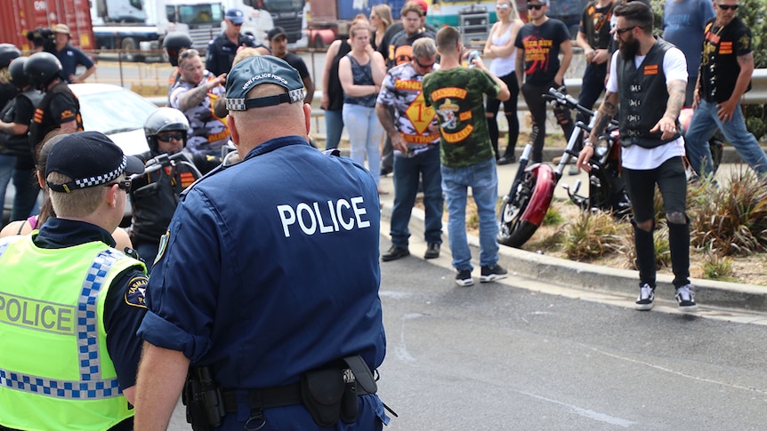 Police watch Bandidos members gathered in Burnie, northern Tasmania, November 2017.