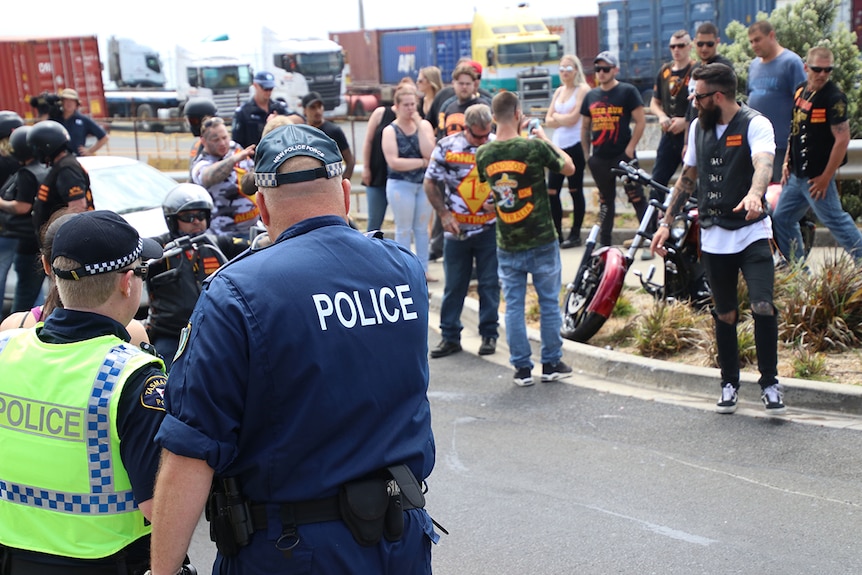 Police watch Bandidos members gathered in Burnie, northern Tasmania, November 2017.