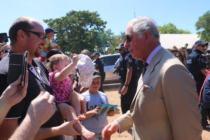 Prine Charles greets a toddler in Nhulunbuy.