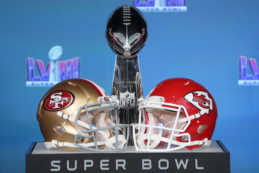 Helmets for the San Francisco 49ers and Kansas City Chiefs on display with the Vince Lombardi Trophy 
