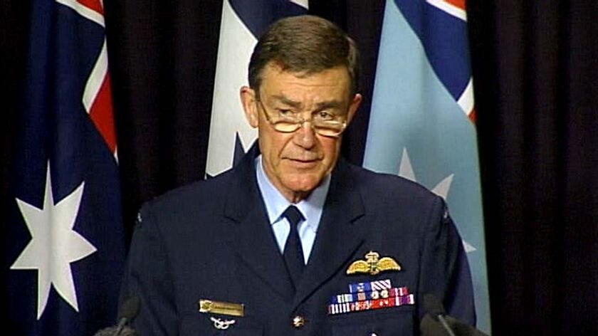 Air Chief Marshal Angus Houston speaks to the media