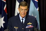 Air Chief Marshal Angus Houston speaks to the media