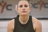 A close up of basketball Tiana Mangakahia's face and upper torso, she's looking directly at the camera.