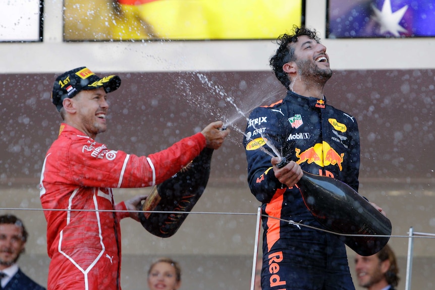 Daniel Ricciardo and Sebastian Vettel spray champagne in Monaco