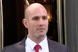 A bald man in a suit