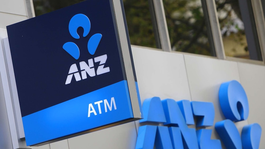 ANZ bank logos are displayed on signs outside a bank branch in Sydney