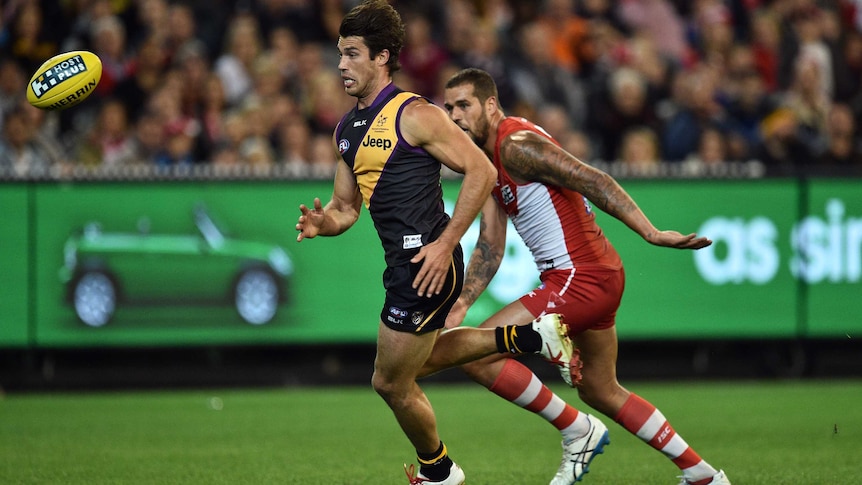Richmond's Alex Rance (L) and Sydney's Lance Franklin contest the ball at the MCG.